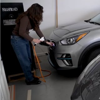 Woman charging EV